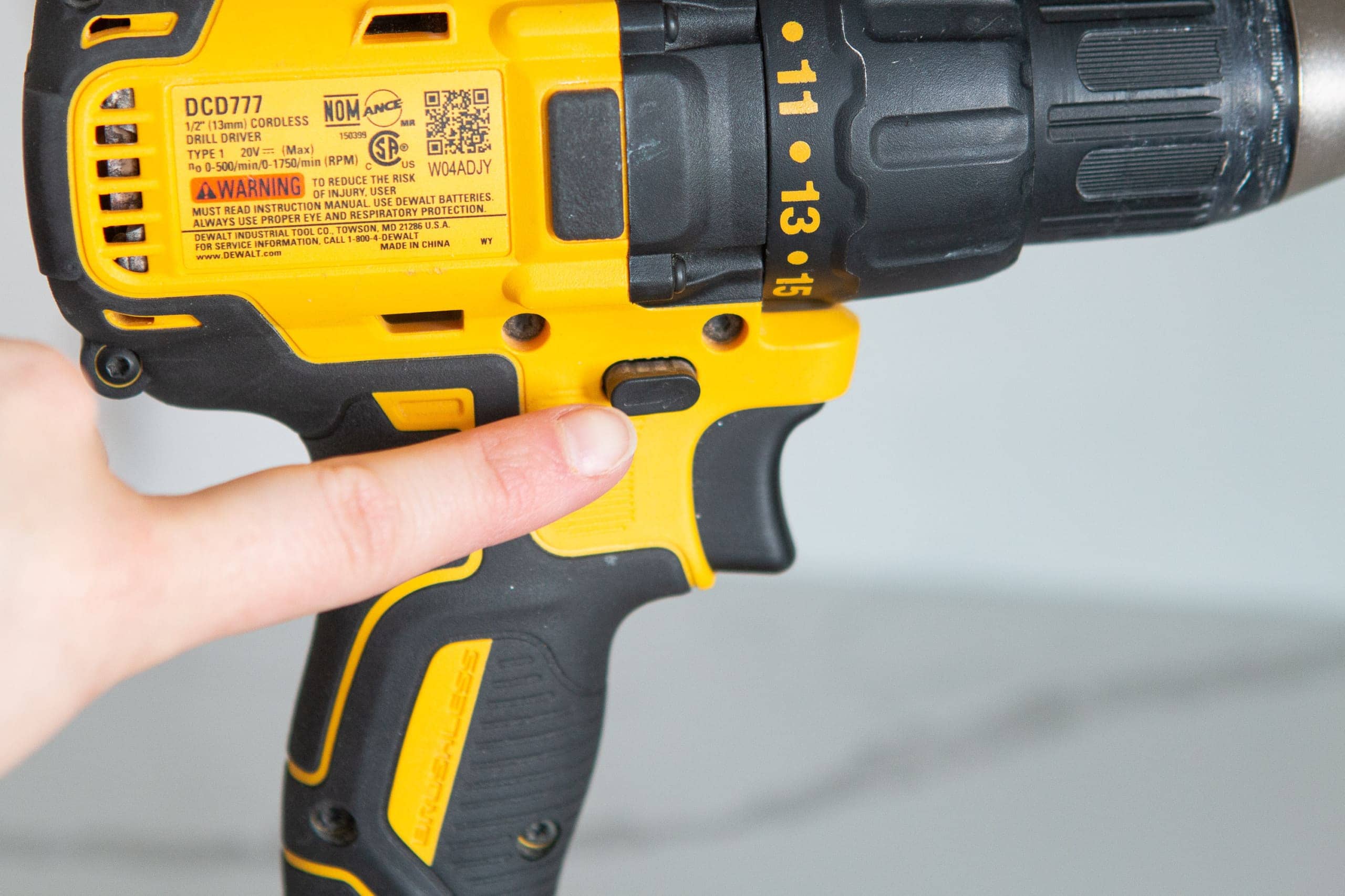 The forward and reverse button the power drill