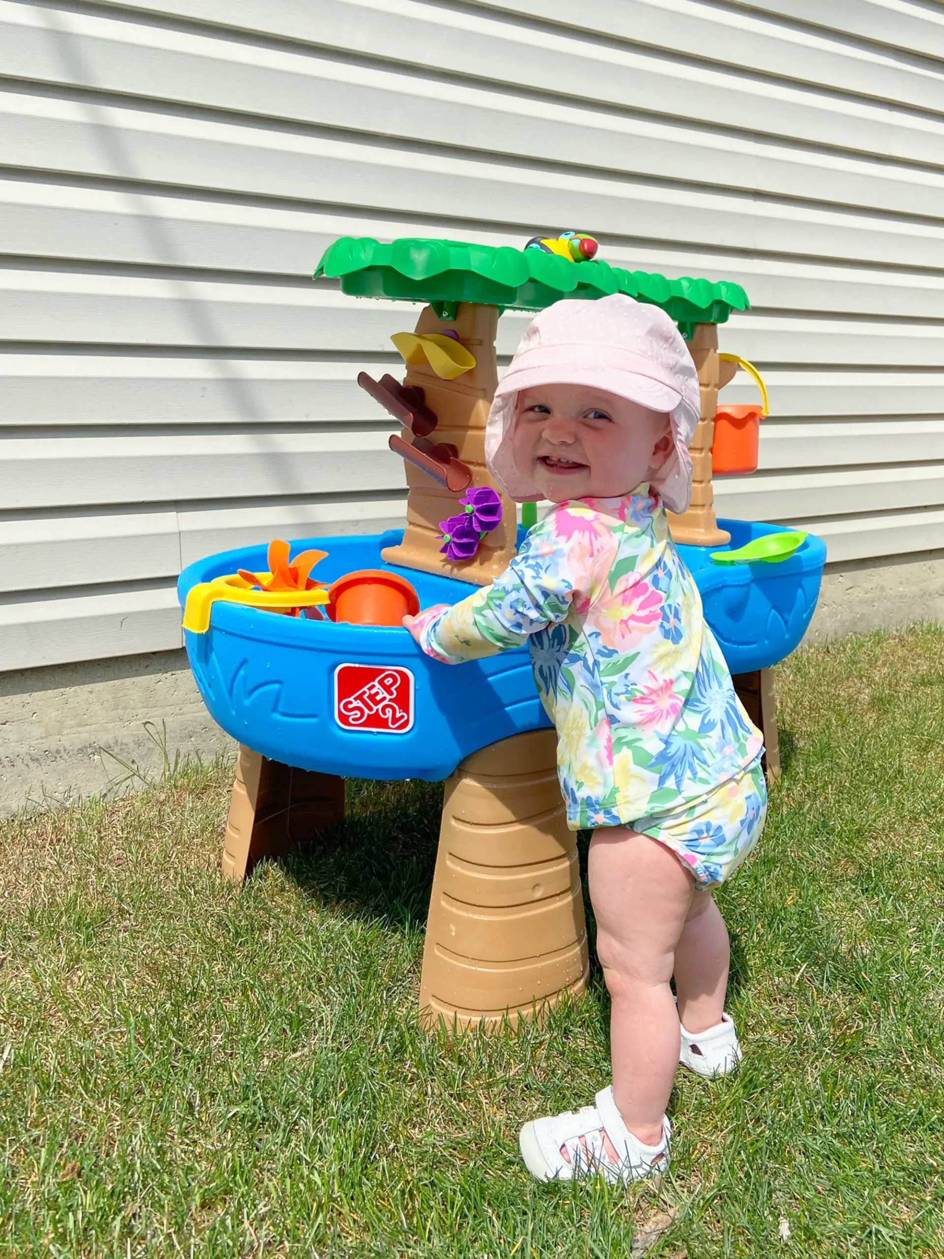Rory playing outside at her water table