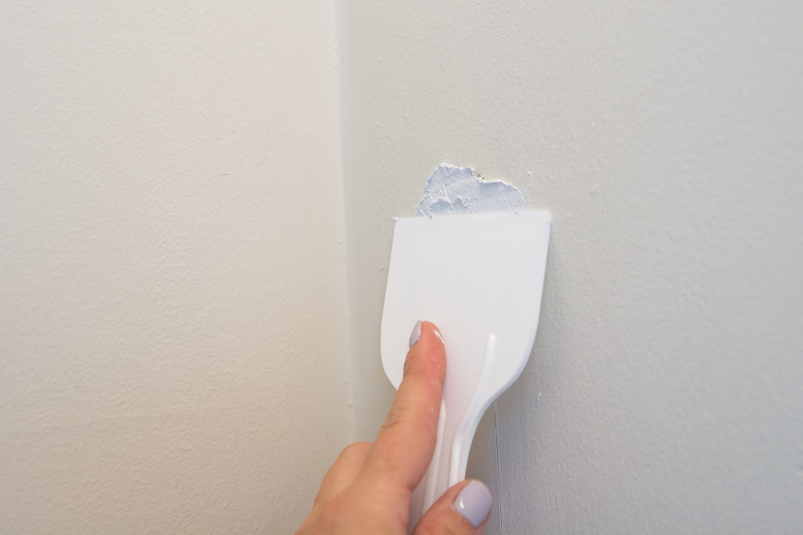 Add spackle to the wall
