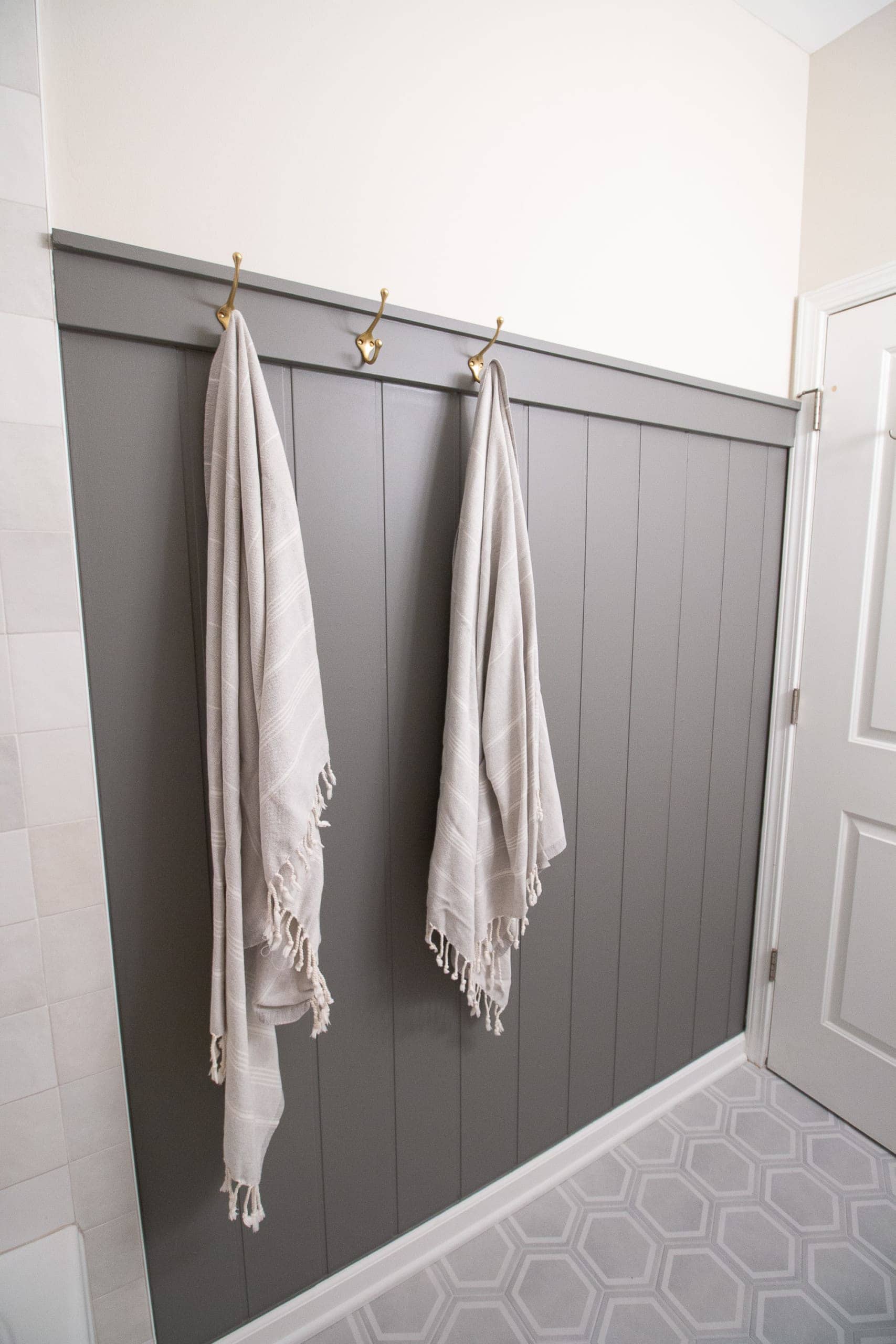 Add a wood wall treatment to your small bathroom for extra storage