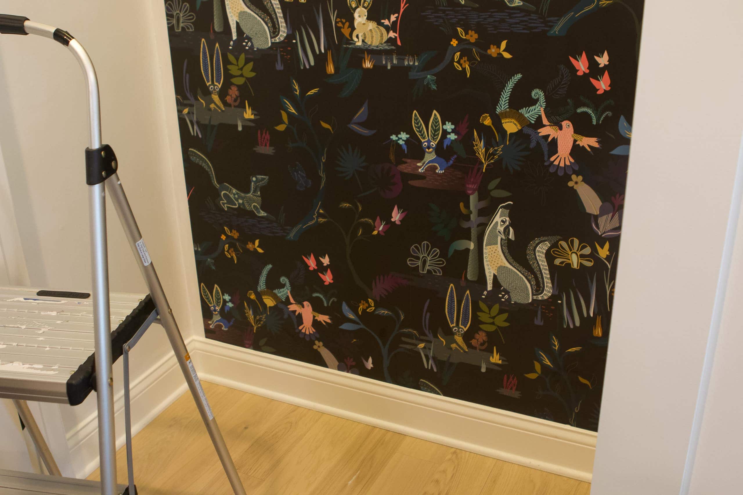 Be sure to match up your pattern when you wallpaper a nursery closet