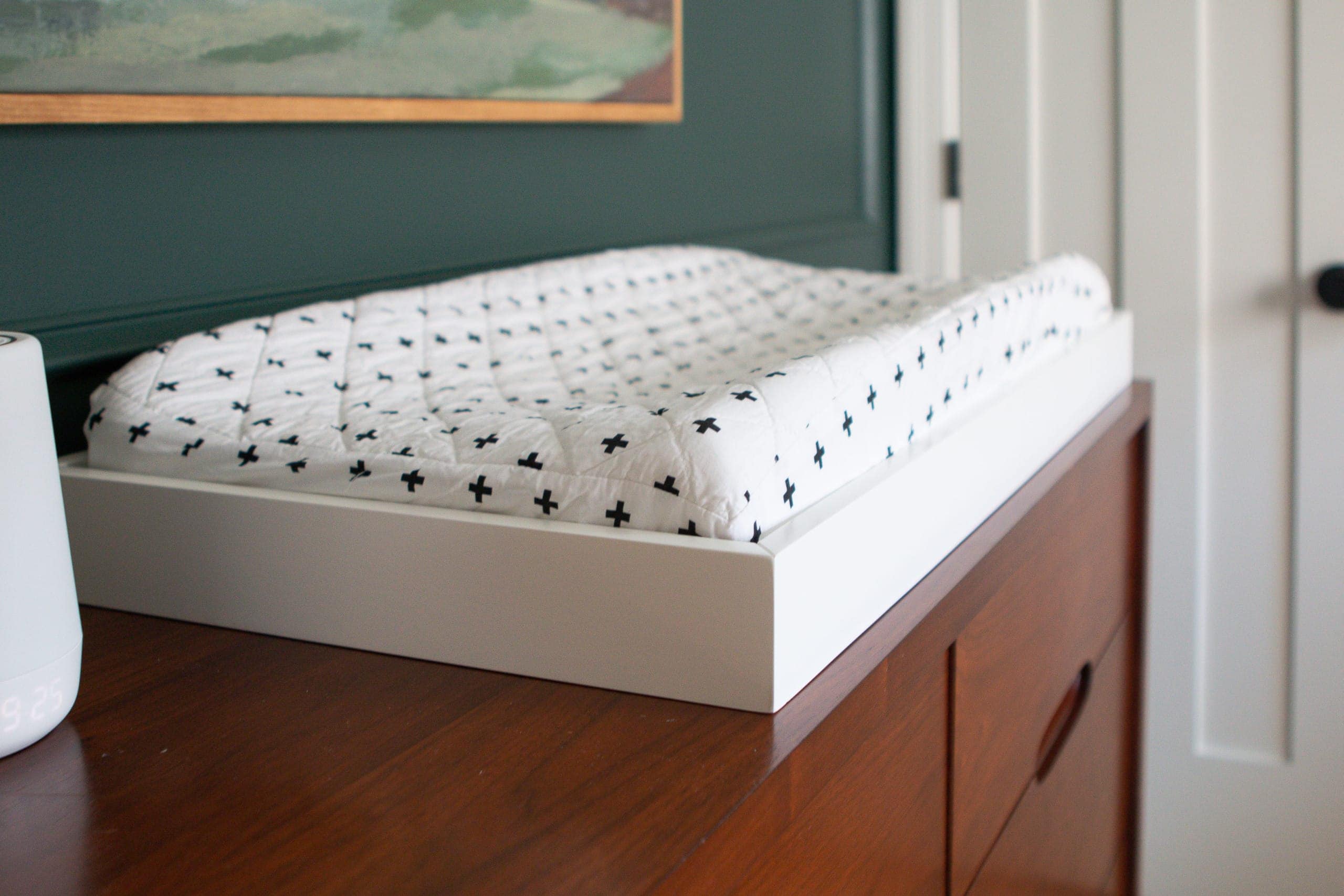 How to attach a changing pad to a dresser