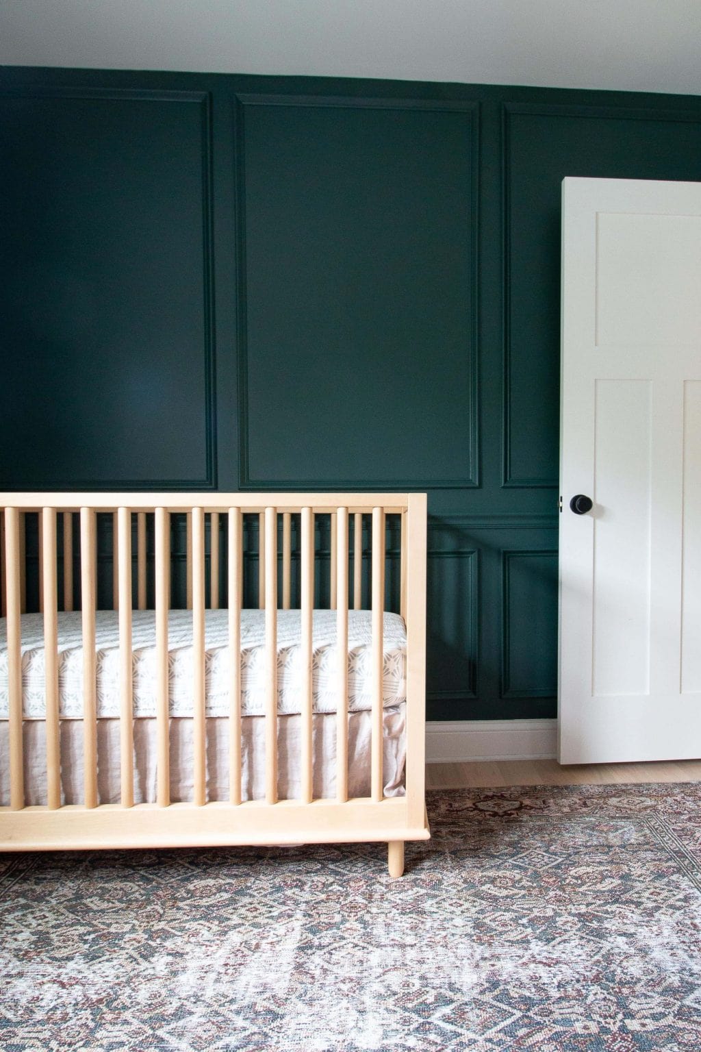 Wood crib in our baby boy nursery reveal