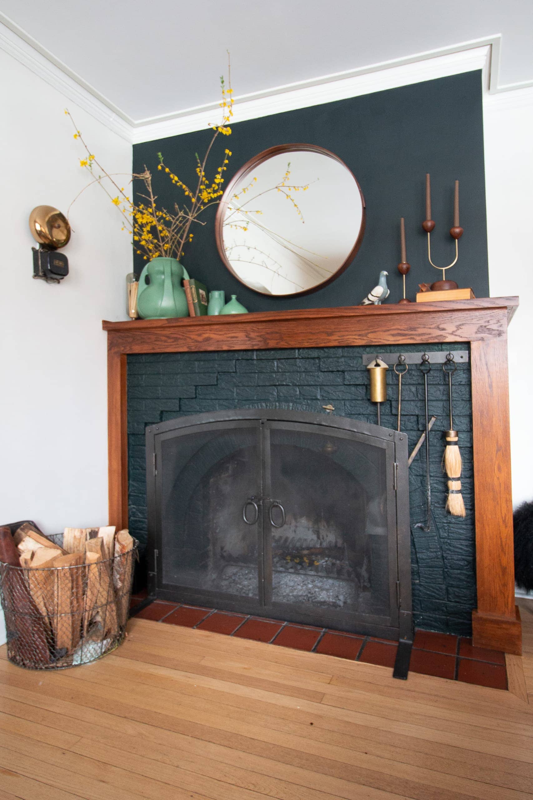 Dark fireplace with a wood mantle