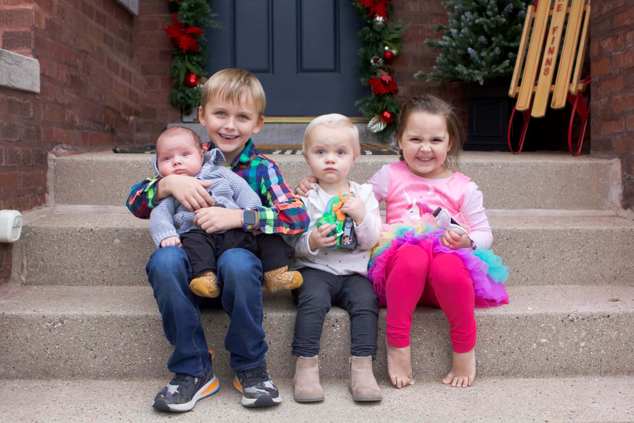 cousins on the front steps