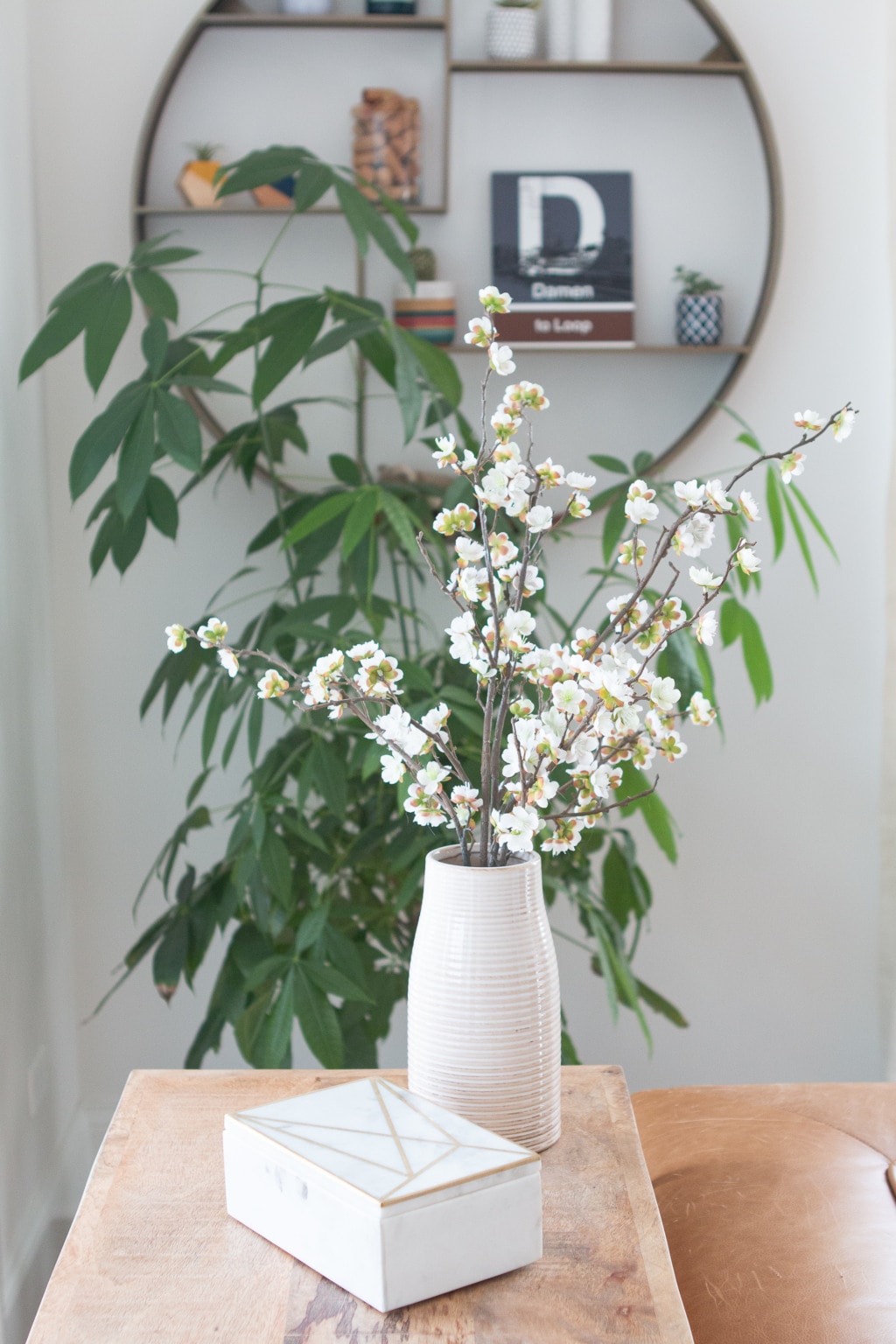 White flowers in a vase in a living room