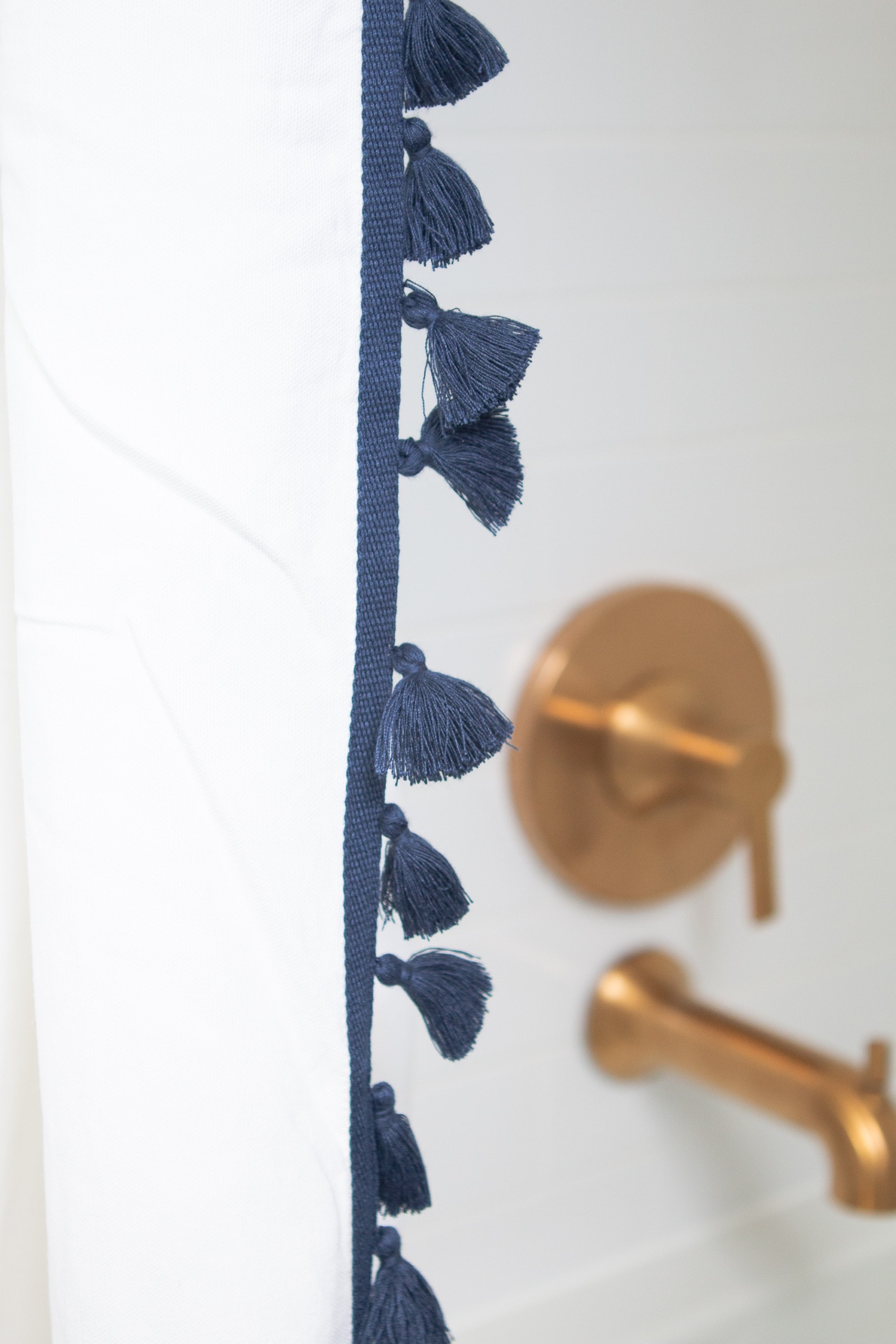 Navy tasseled shower curtain