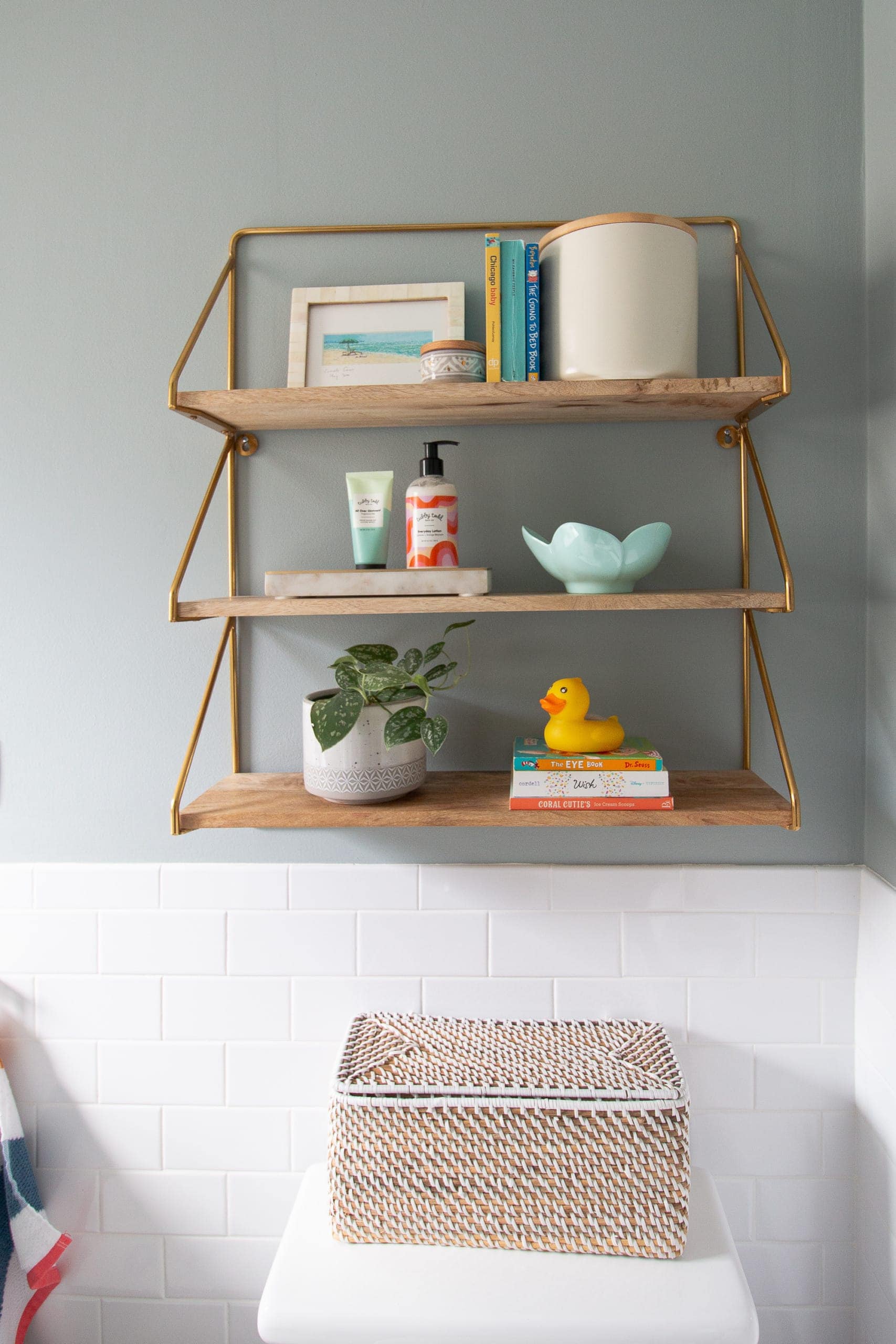 Styling shelves in a kids bathroom space