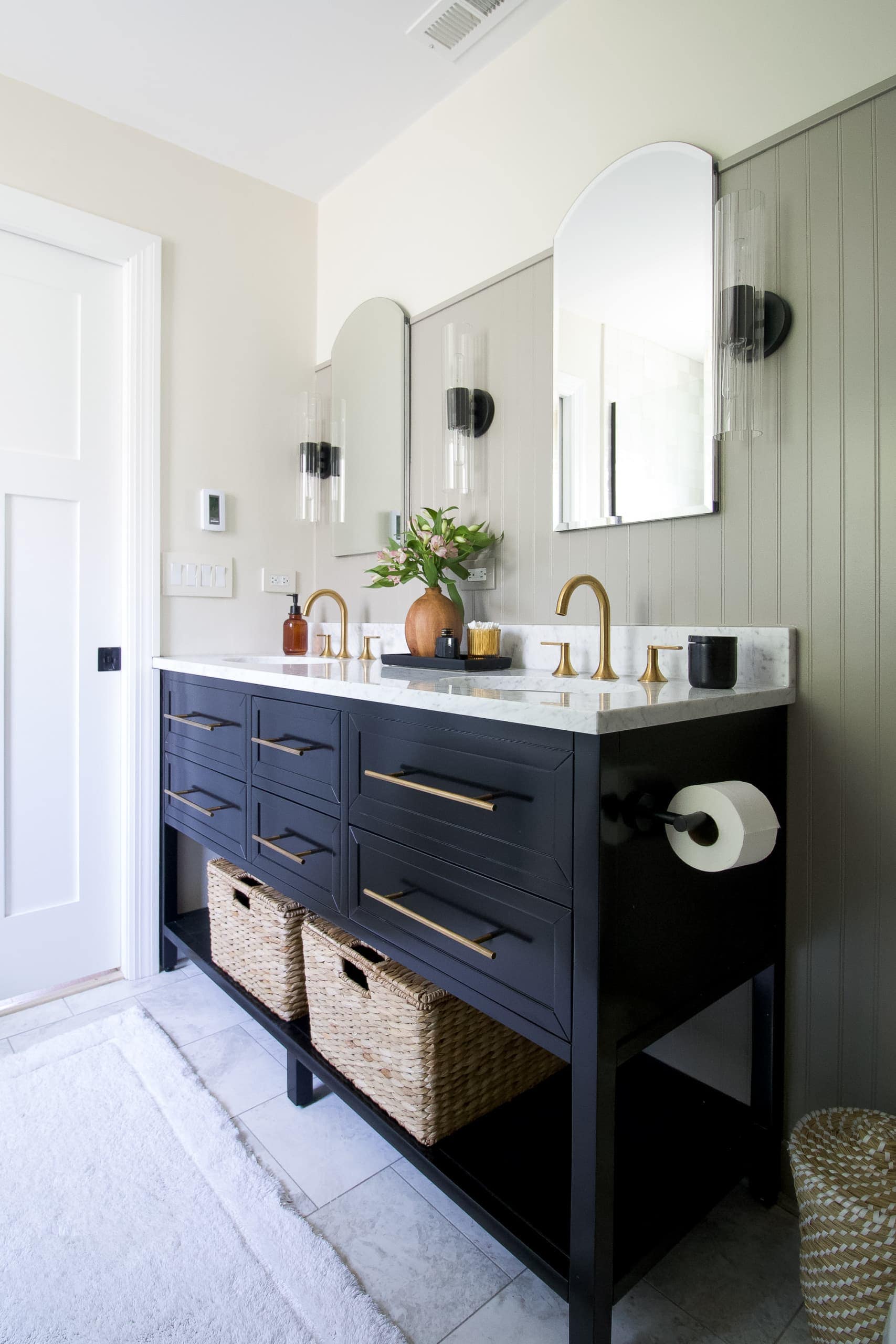 Black and gold vanity in a bathroom