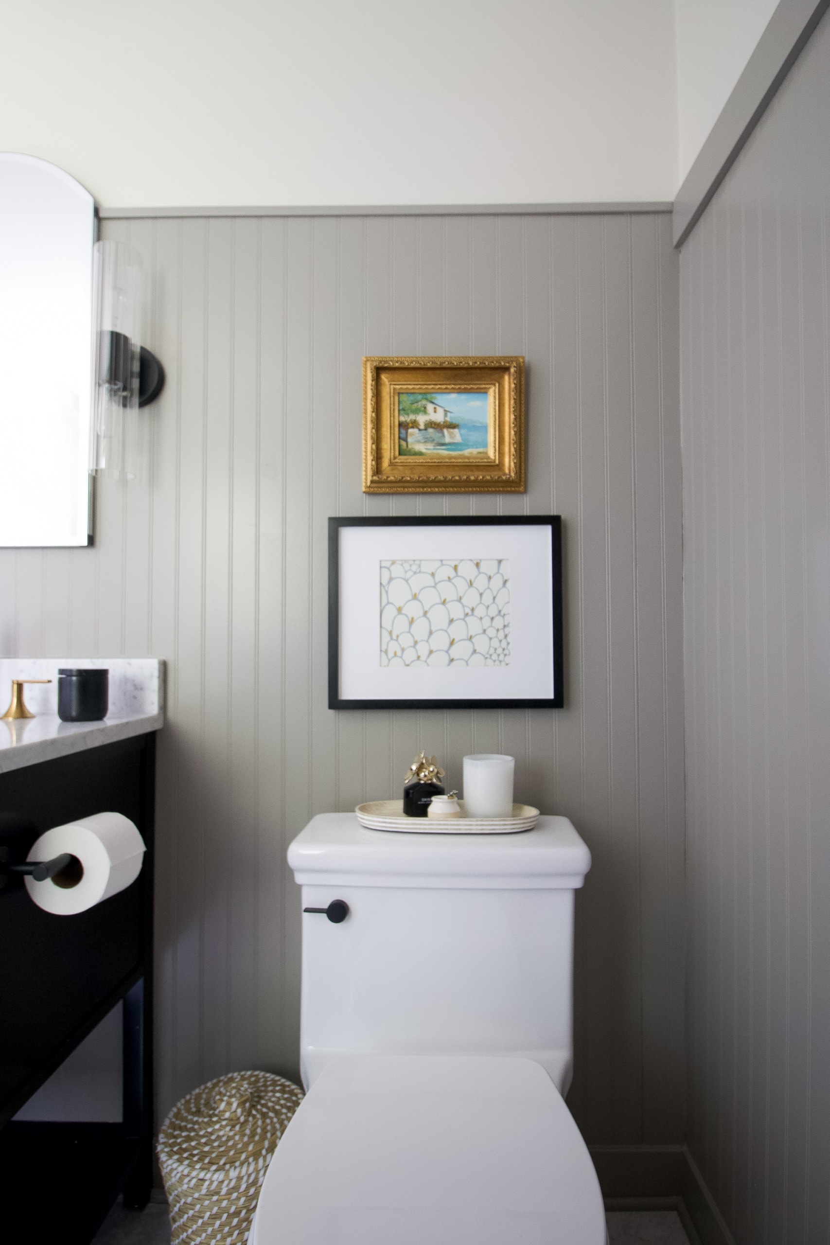 The toilet in our black and gold marble bathroom