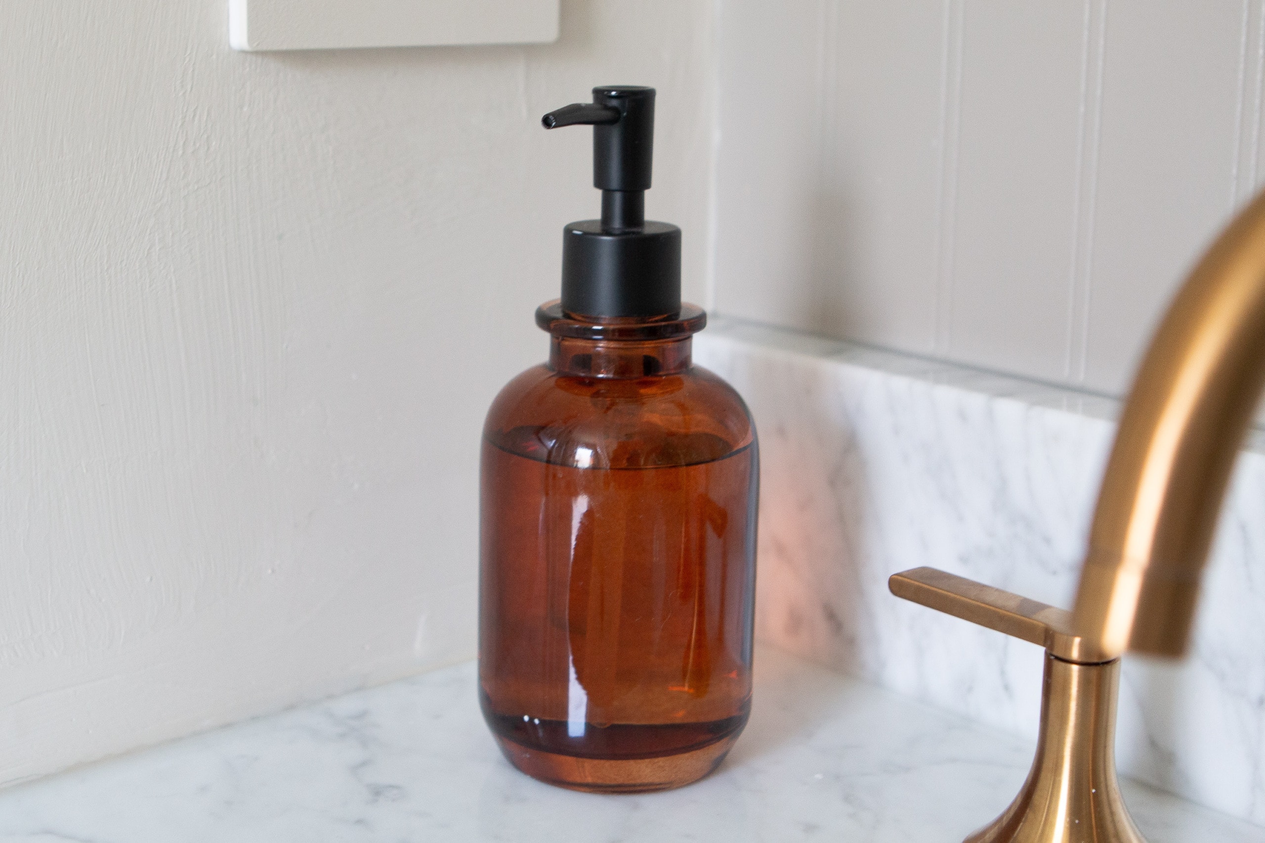 Using an amber colored soap dispenser for my bathroom decor ideas