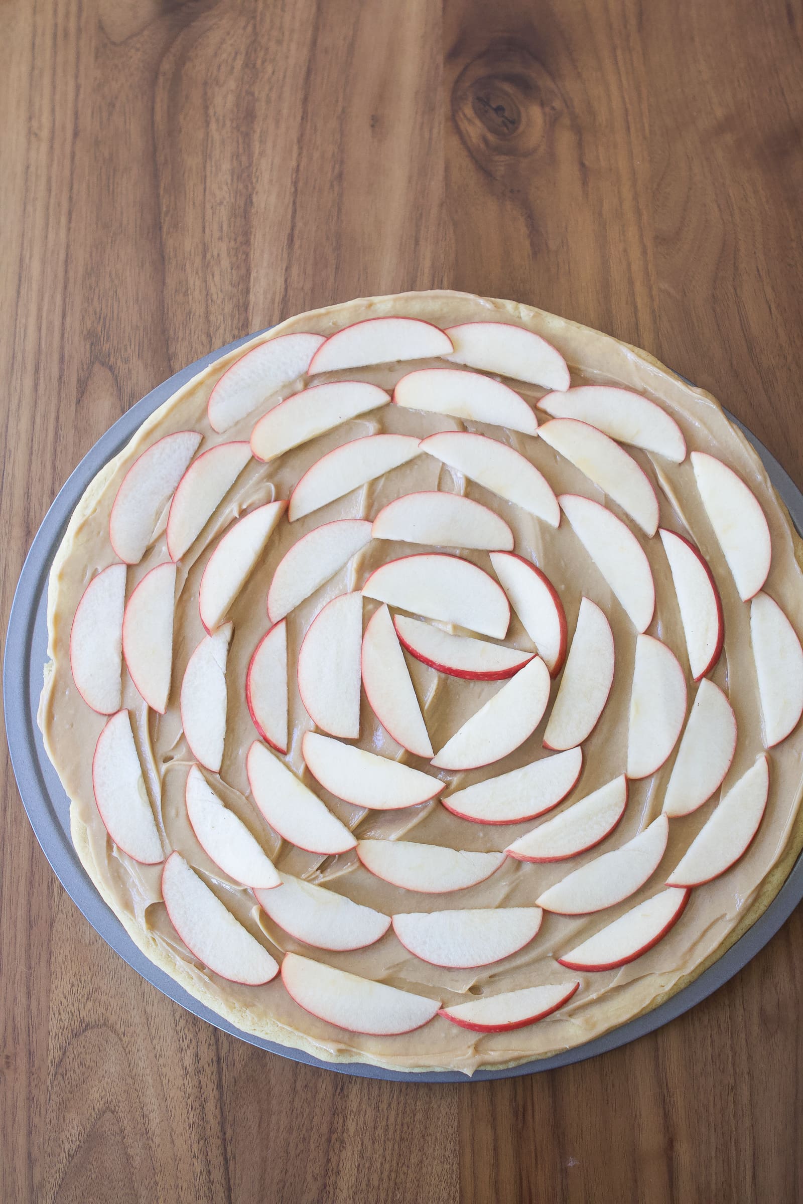 Add apples in a fan on top of your pizza