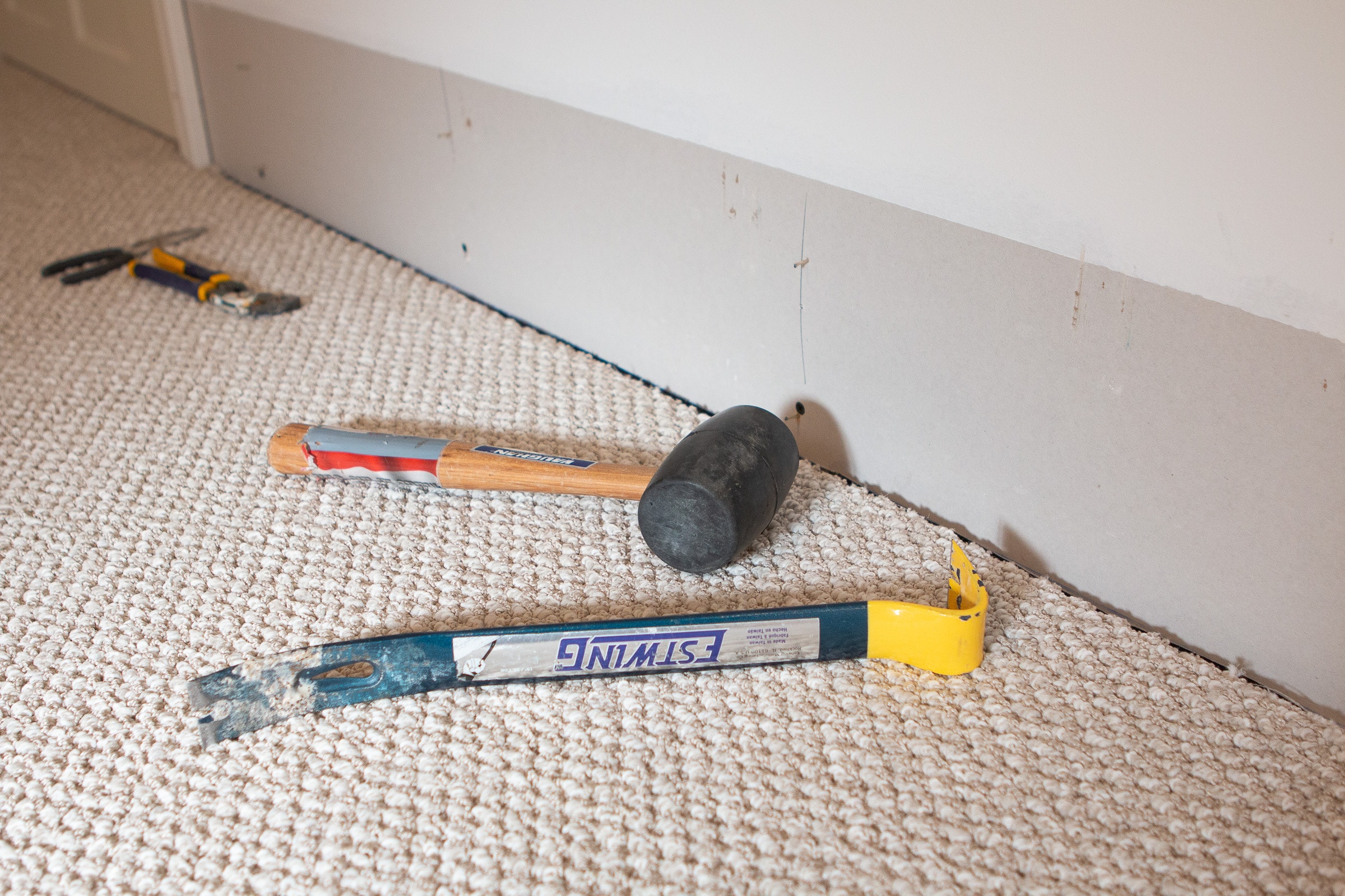 use a crowbar and mallet to remove the baseboard