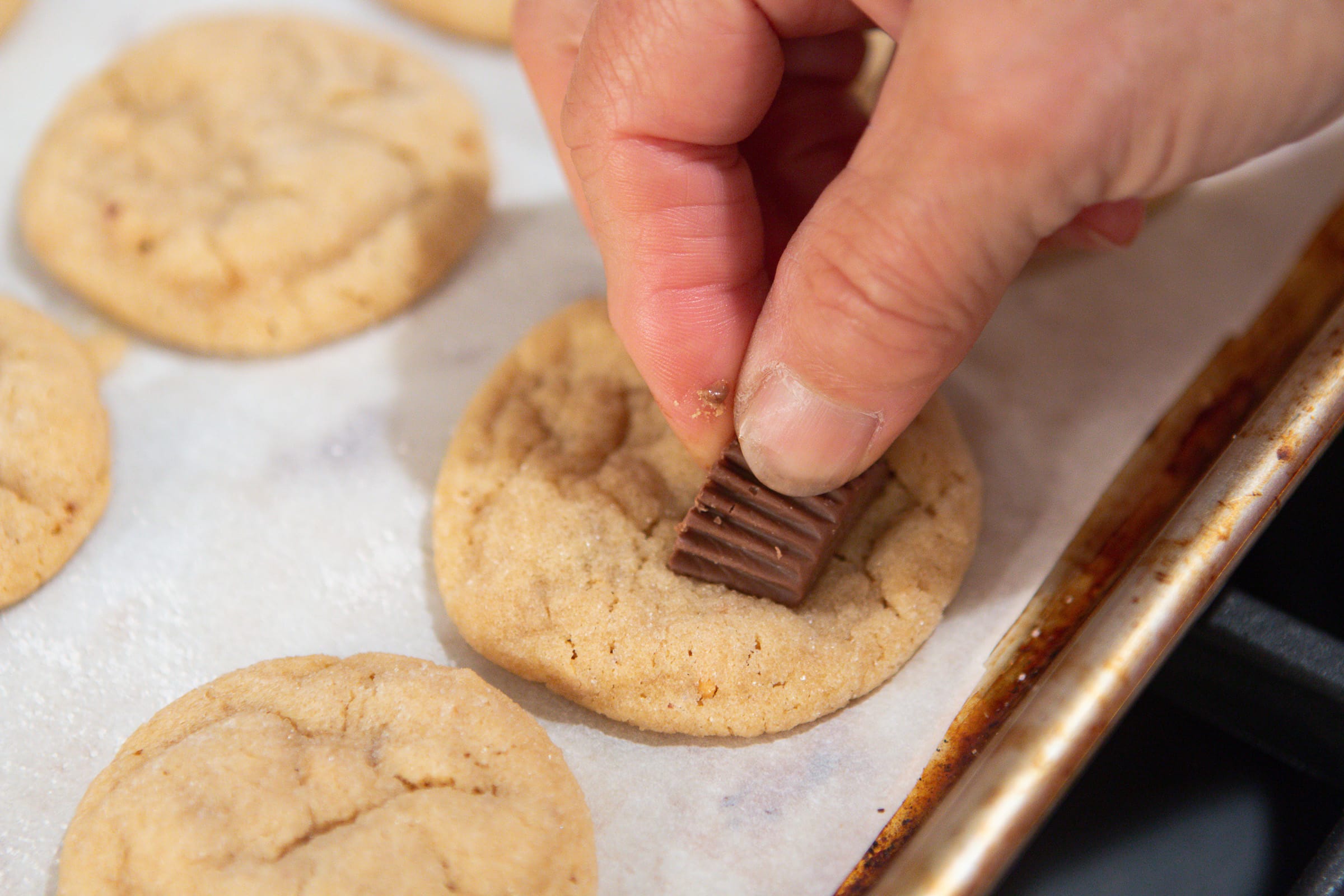 Adding peanut butter Reese's to the bottom of the cookie