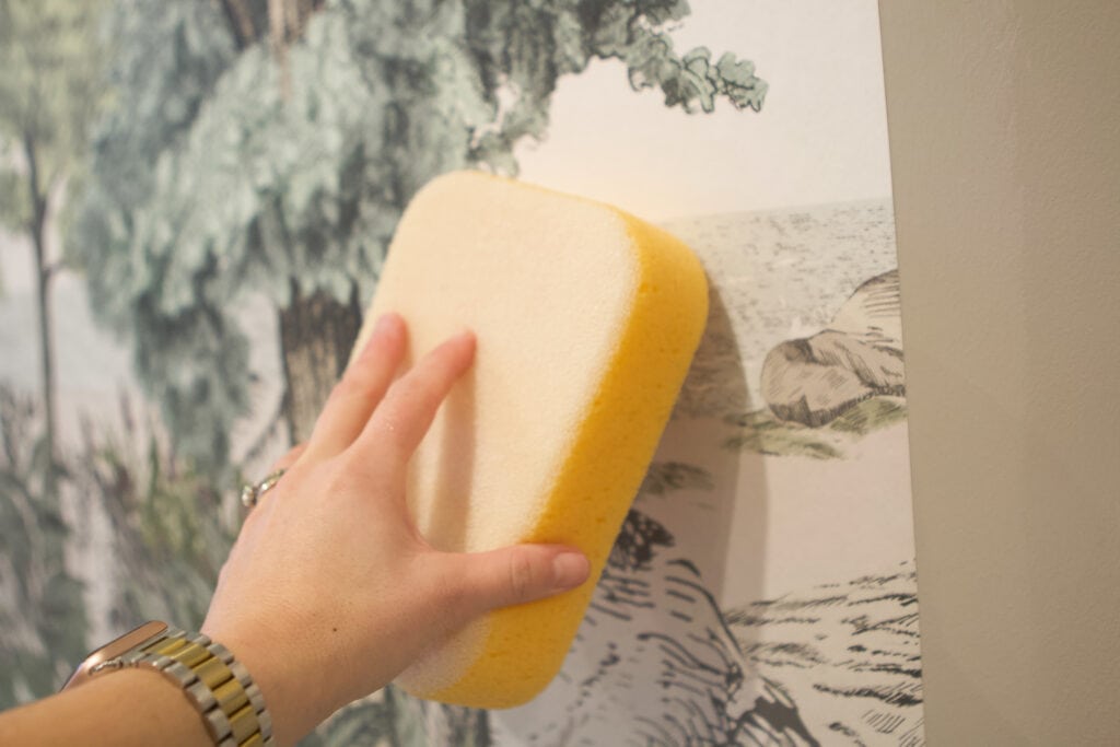 Wipe off excess glue with a clean and damp sponge