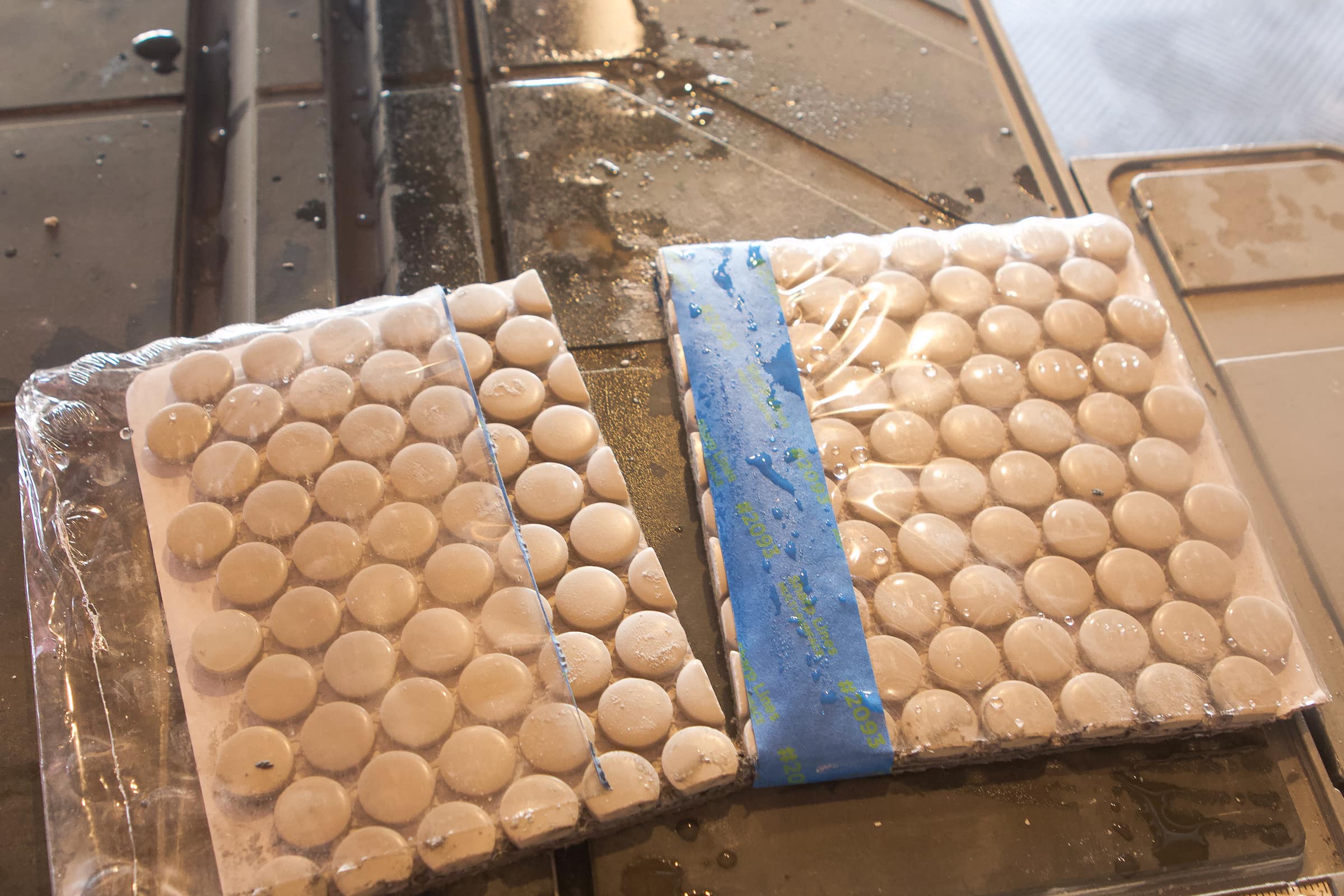 Keep your penny tile in the packaging when cutting it on the wet saw
