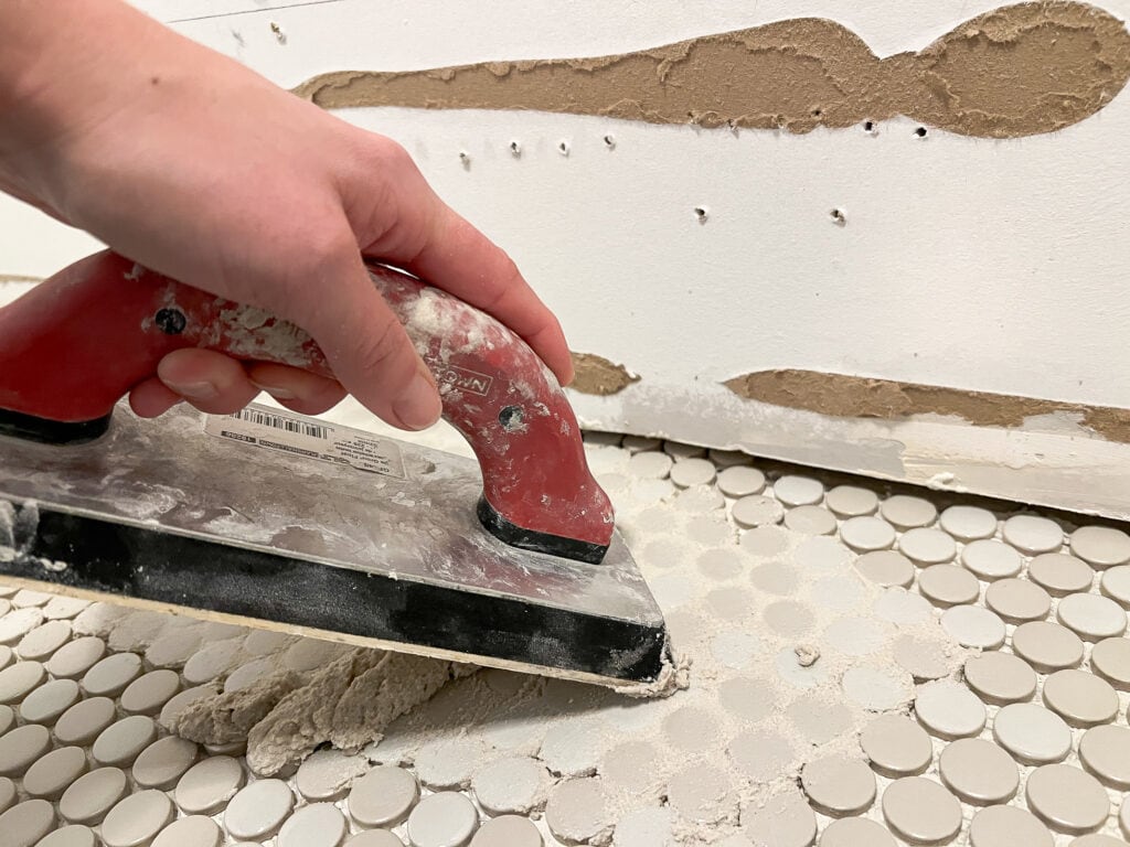 Use your grout float to press the grout into the joints
