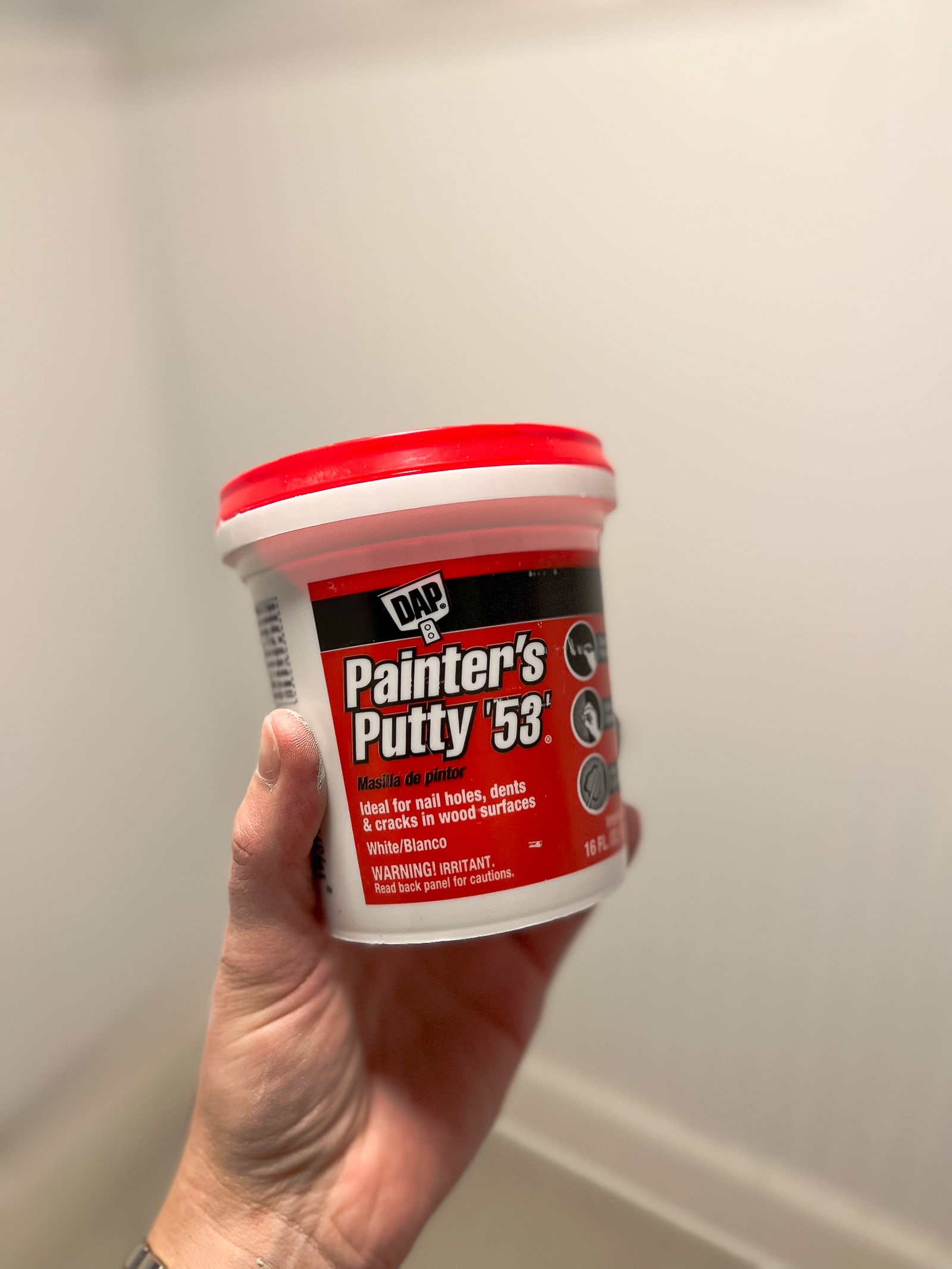 Use painter's putty to fill nail holes in beadboard