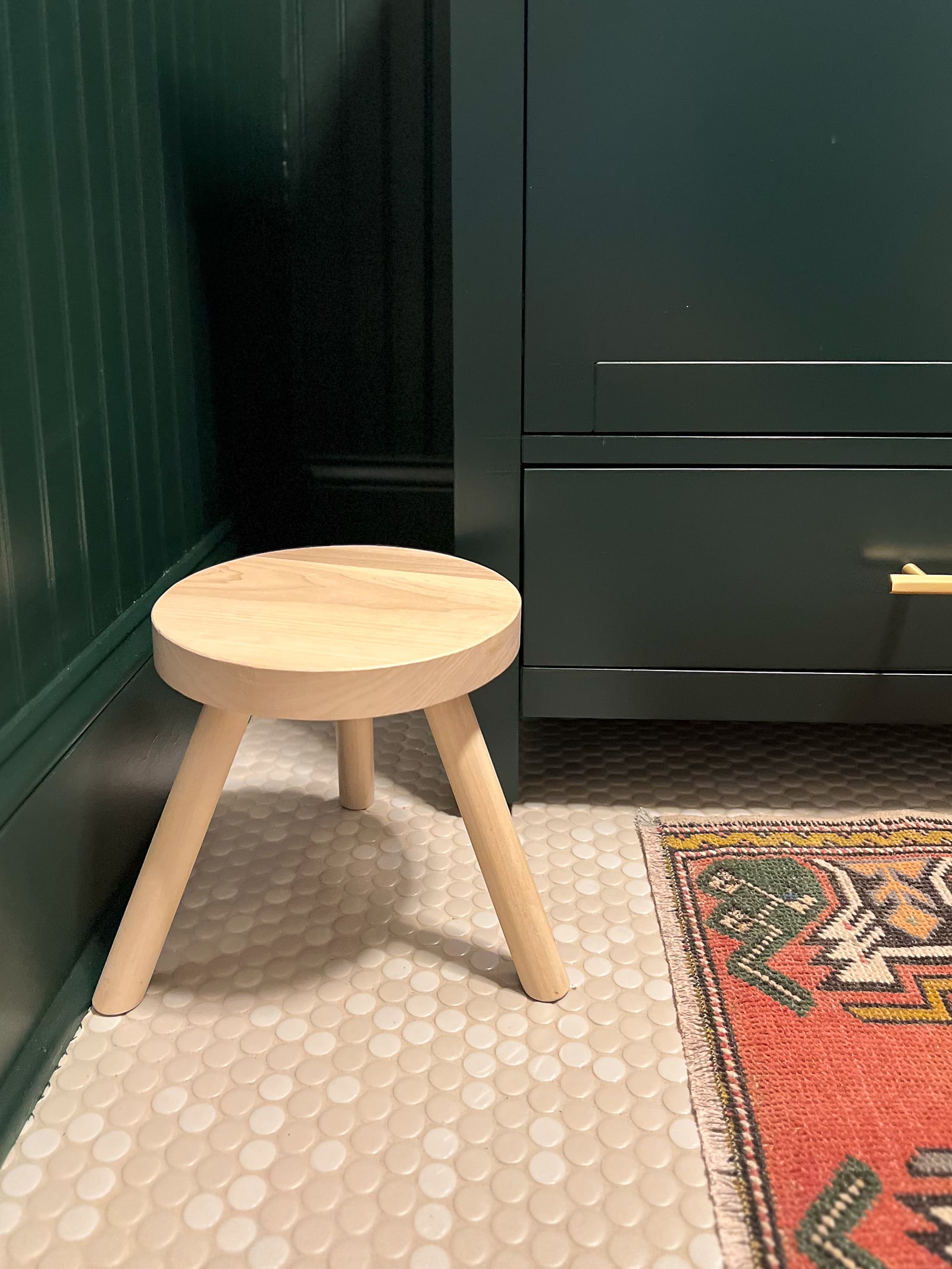 Wood step stool in a bathroom