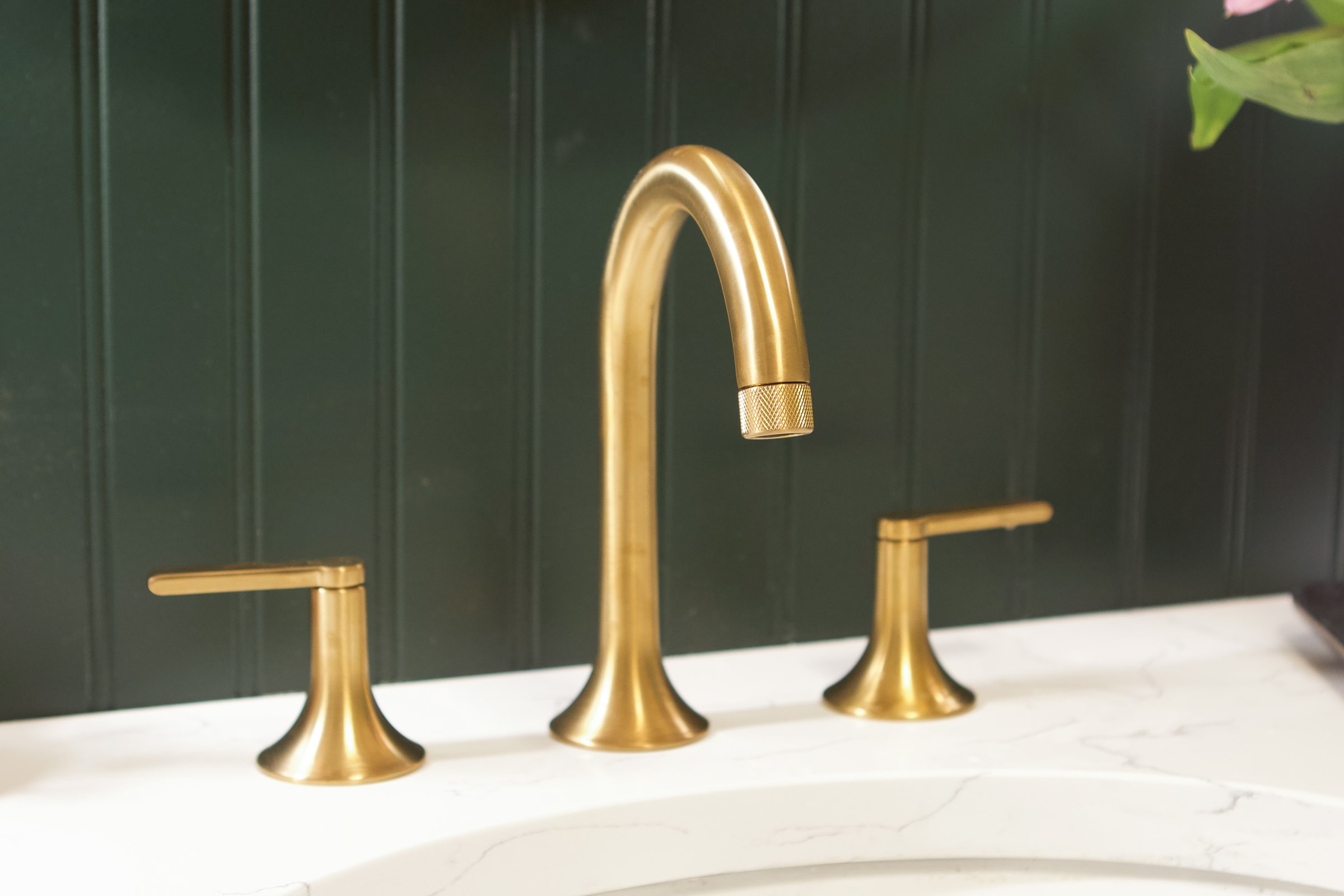 Gold faucet in the bathroom