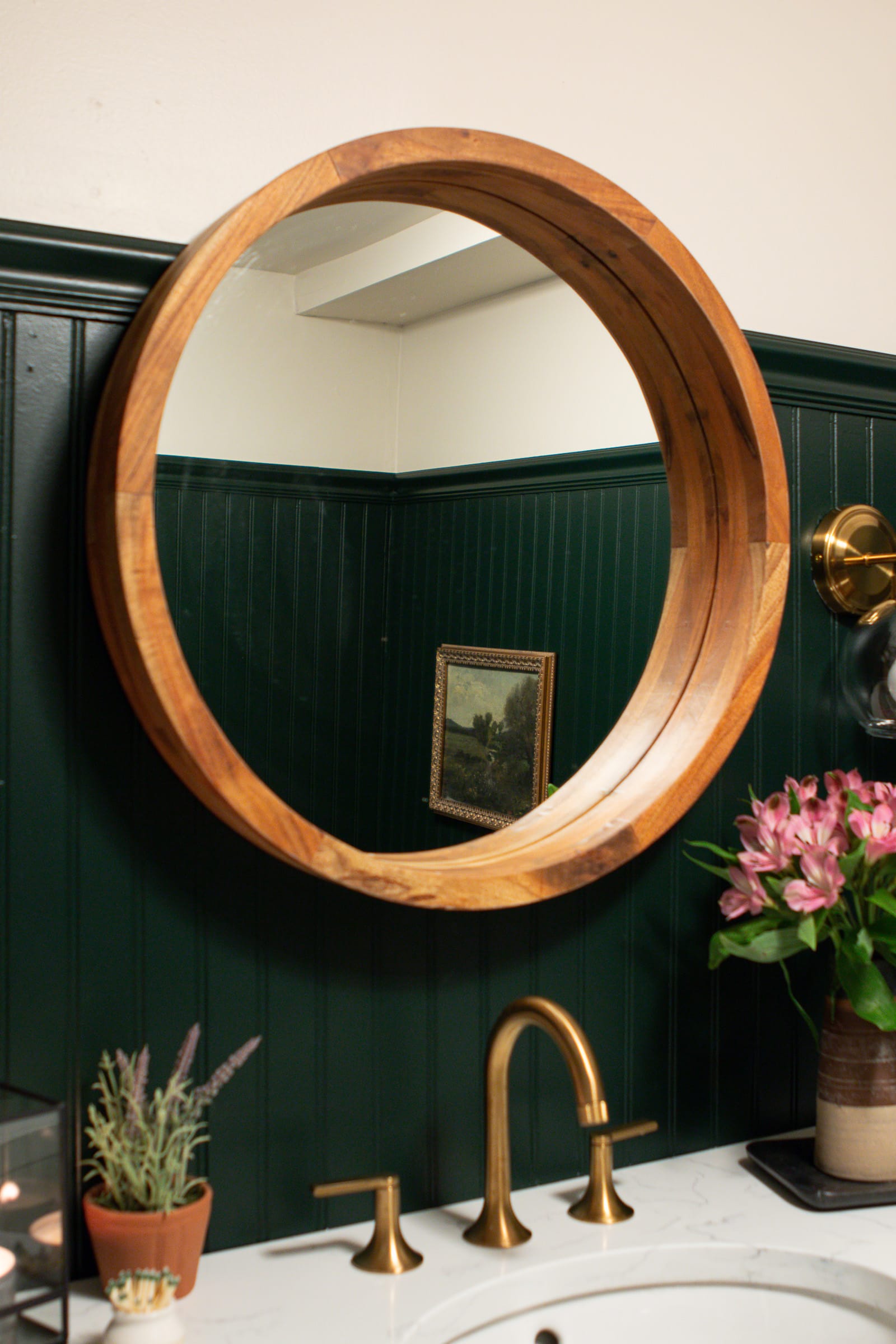 Using a round wood mirror in my new dark green bathoom