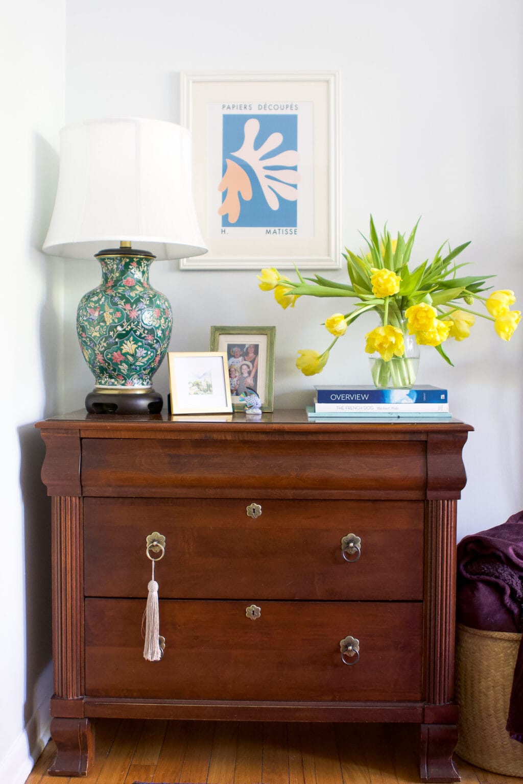 An antique dresser in a colorful living room