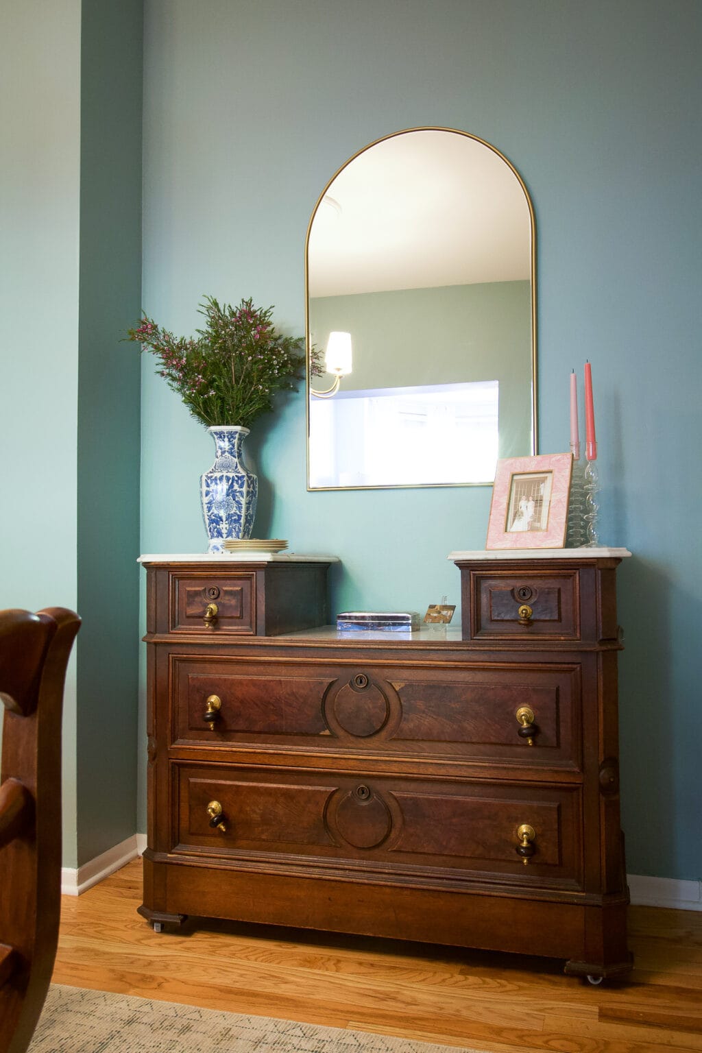 An antique dresser in a dining room 