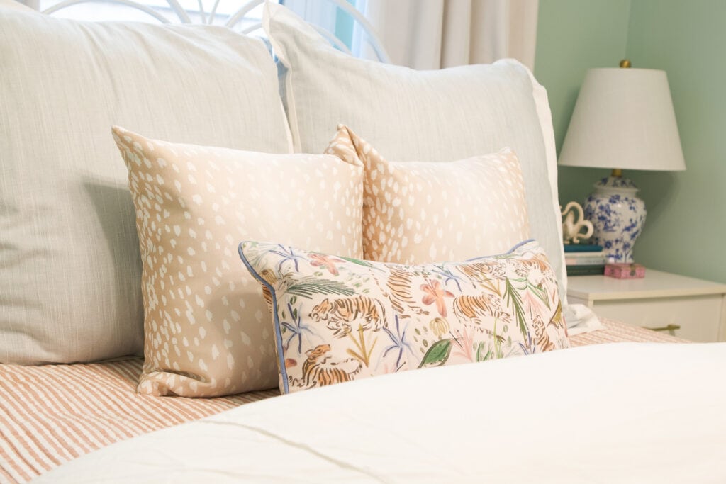 Gorgeous pillows on a feminine bed