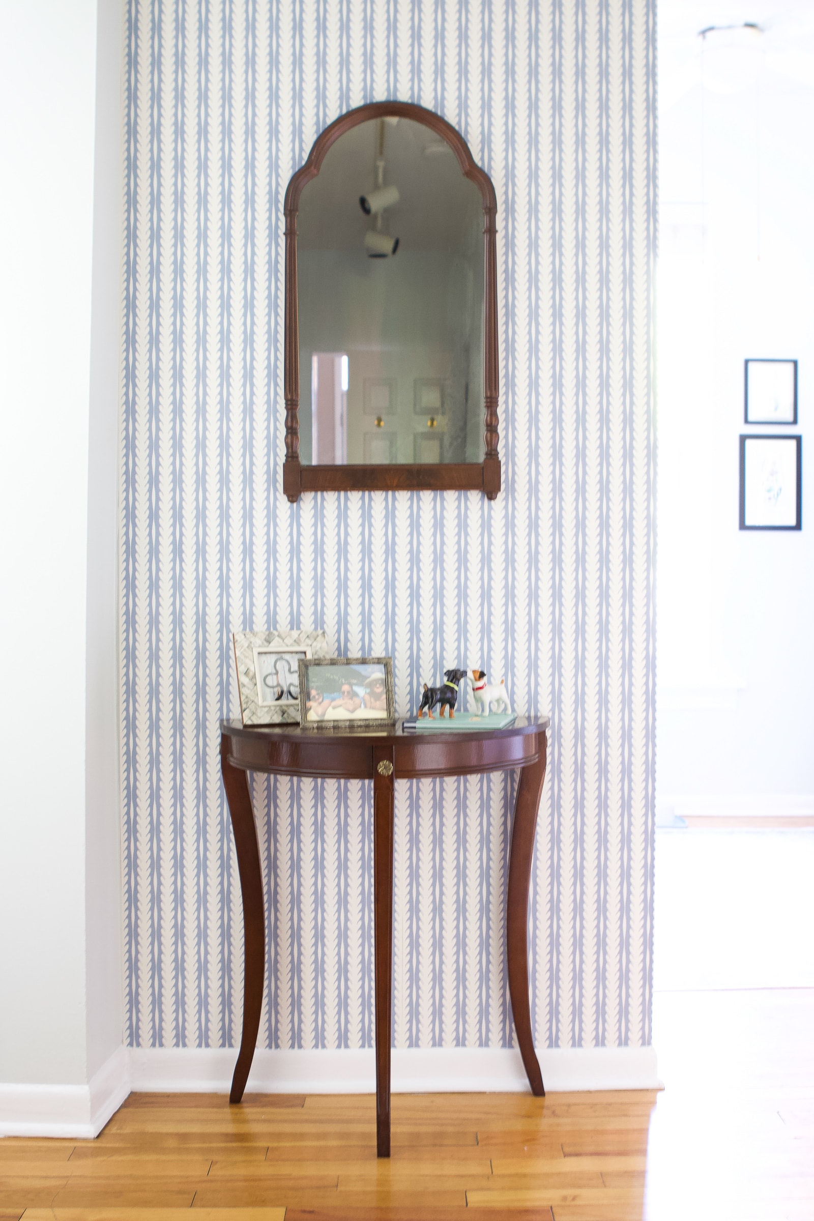 An entryway with gorgeous wallpaper