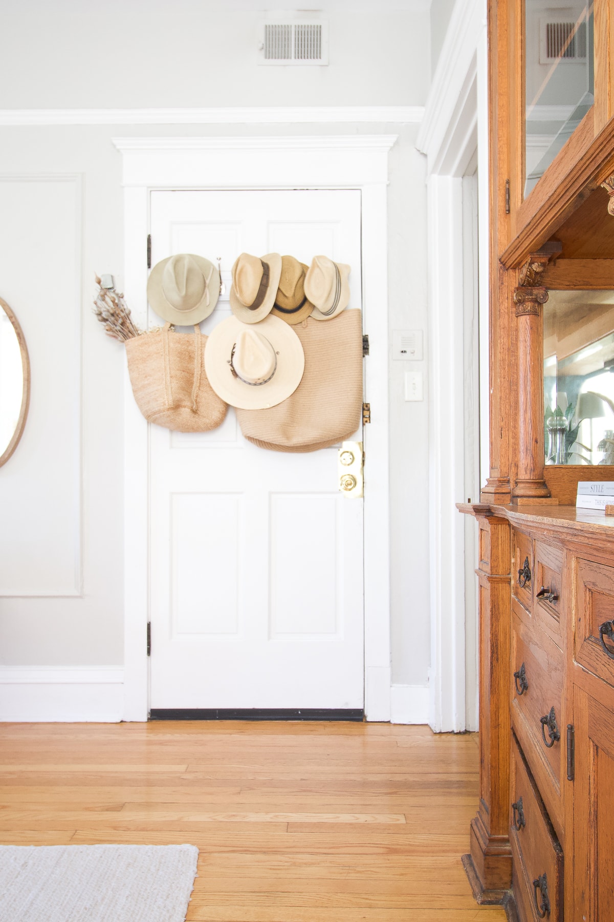Create an entryway with hooks on the back of a door