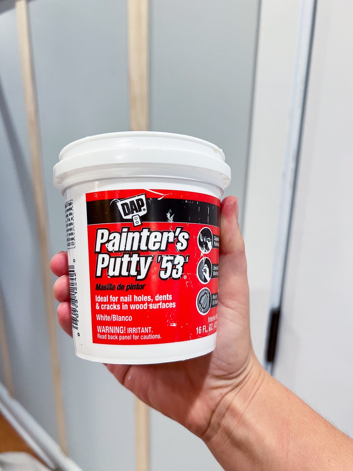 Use painter's putty to fill nail holes in your wood