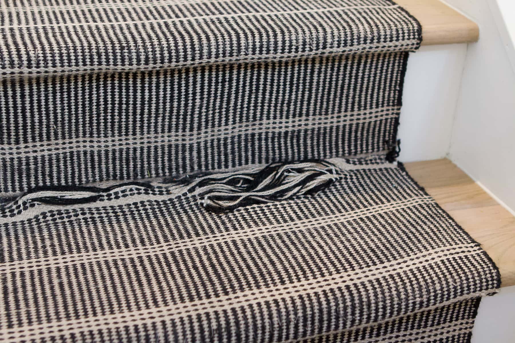 Our stair runner unraveling